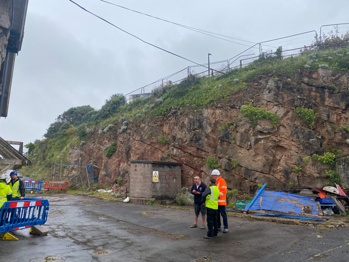 A view of the cliff behind the landside buildings before work began.